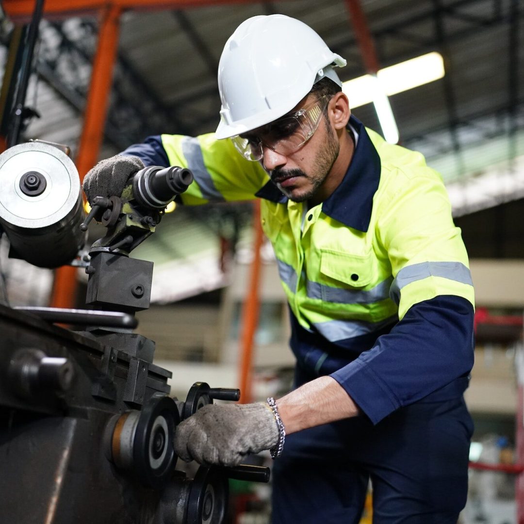 industrial factory worker working in metal manufacturing industry
